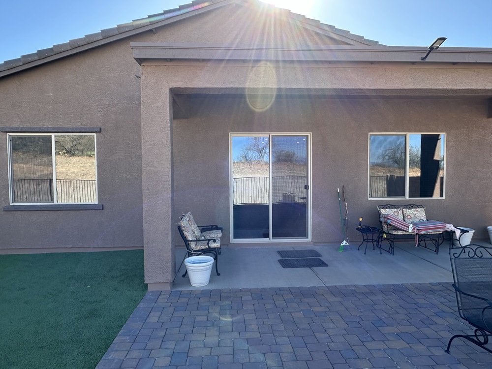 Exterior of a home with tinted windows.