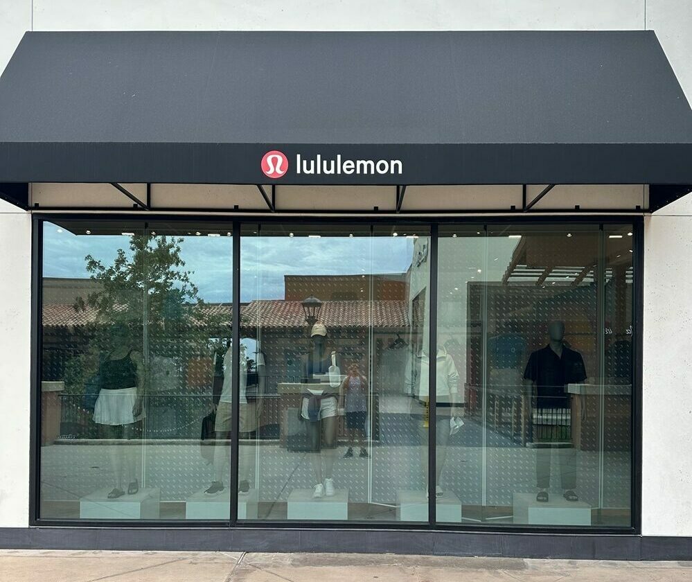 A Lululemon store with tinted windows.